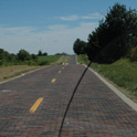 A little piece of history from 1932. An original brick road just North of Auburn, IL. It is a bare 1.5 mile long very well preserved old section of R66. As you notice it must be the beginning of the journey as not many dead flies decorate my windshield. By the way, the road is surprisingly insect free all way long.